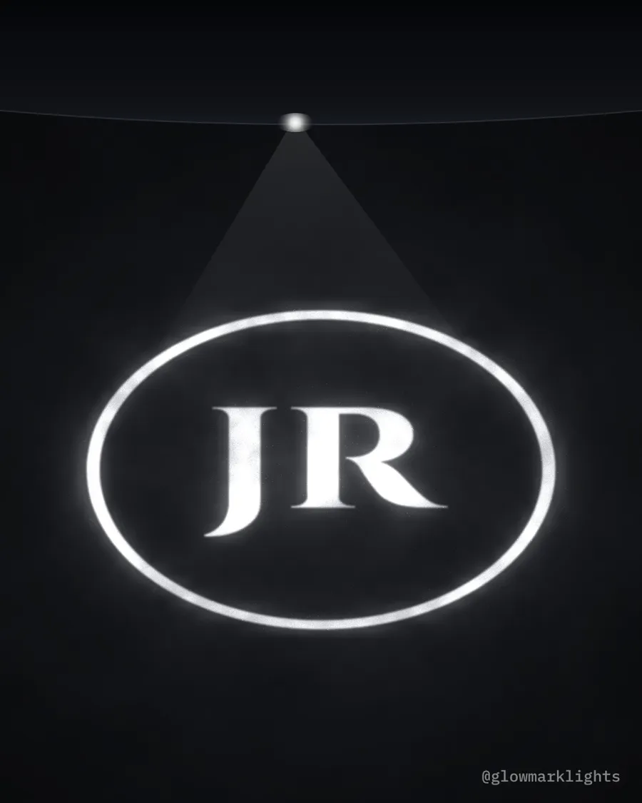 The initials JR in a ring of light