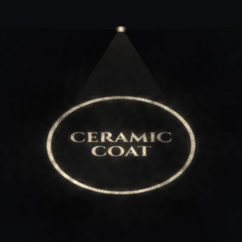 Sample shop logo reading Ceramic Coat, glowing on asphalt